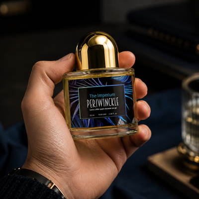 The Imperium 50ml Periwinckle parfum bottle held in hand for scale